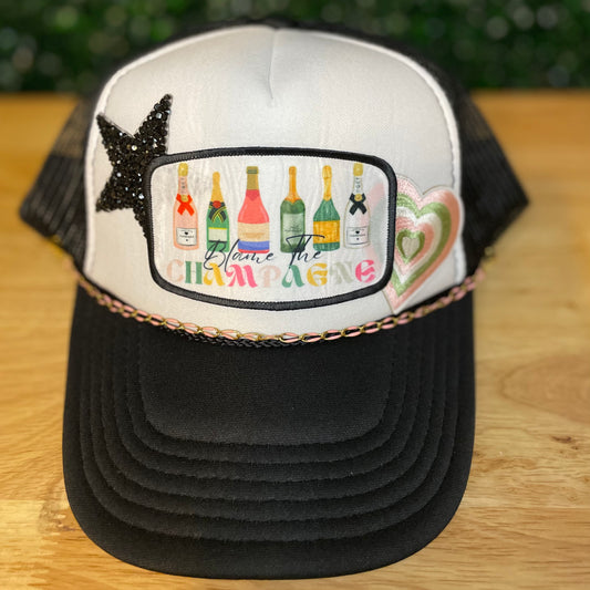 Blame The Champagne Trucker Hat